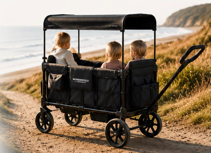 WonderFold wagon on a beach path with children at golden hour